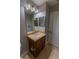 Bathroom features tile floors, vanity with a sink, and a mirror with vanity lighting at 3210 Mangrove Point Dr, Ruskin, FL 33570
