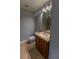 Bathroom features tile floors, vanity with a sink, toilet, and a walk-in shower at 3210 Mangrove Point Dr, Ruskin, FL 33570