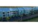 Exterior view of a multi-story condo complex with balconies and palm trees at 3210 Mangrove Point Dr, Ruskin, FL 33570