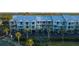 Exterior shot of a beautiful condo complex with lovely pastel colors and balconies at 3210 Mangrove Point Dr, Ruskin, FL 33570