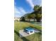 Community games area with cornhole and outdoor seating near the bay at 3210 Mangrove Point Dr, Ruskin, FL 33570