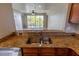 Kitchen with a view of the living room and balcony in this condo at 3210 Mangrove Point Dr, Ruskin, FL 33570