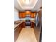 Well-lit kitchen with stainless steel appliances, wood cabinets, and granite countertops at 3210 Mangrove Point Dr, Ruskin, FL 33570