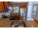 A kitchen featuring a stainless steel fridge, sink, and view to the outside at 3210 Mangrove Point Dr, Ruskin, FL 33570