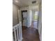 Upstairs hallway with a laundry closet with a stacked washer and dryer at 3210 Mangrove Point Dr, Ruskin, FL 33570