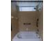 The bathroom features a tiled shower with a window at 3210 Mangrove Point Dr, Ruskin, FL 33570