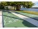 Community shuffleboard court with views of the bay at 3210 Mangrove Point Dr, Ruskin, FL 33570