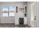 Butler's pantry featuring beverage cooler, glass-front cabinets, open shelves and outdoor views at 3422 E Powhatan Ave, Tampa, FL 33610