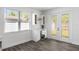 Cozy butler's pantry with modern beverage cooler, glass-front cabinets, and natural light from the windows at 3422 E Powhatan Ave, Tampa, FL 33610