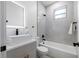 Stylish bathroom with a modern vanity, vessel sink, sleek fixtures, and tiled shower/tub combo at 3422 E Powhatan Ave, Tampa, FL 33610