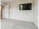 Neutral bedroom with plush gray carpeting and prewired for a wall mounted television at 35168 Arya Way, Zephyrhills, FL 33541