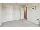 Cozy bedroom with plush carpet, dual closets, and white doors for a clean, modern look at 35168 Arya Way, Zephyrhills, FL 33541