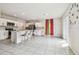 Bright, open kitchen featuring white cabinetry, stainless steel appliances, and a large island with bar seating at 35168 Arya Way, Zephyrhills, FL 33541