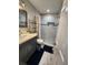 Updated bathroom features modern vanity, tiled shower with built-in niche, and updated fixtures at 4119 W Nassau St, Tampa, FL 33607