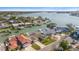 Aerial view of the waterfront property showcasing the home's location, lush surroundings, and scenic water views at 4544 Harbor Hills Dr, Largo, FL 33770