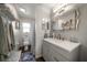 Bathroom featuring modern vanity, framed mirror, and shower-tub combination at 4544 Harbor Hills Dr, Largo, FL 33770