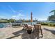 Waterfront home features a private dock with outdoor seating, perfect for enjoying waterfront views and relaxation at 4544 Harbor Hills Dr, Largo, FL 33770