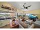 Comfortable living room with water views, stylish furnishings, and a ceiling fan at 4544 Harbor Hills Dr, Largo, FL 33770