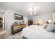 Bright main bedroom with modern lighting, neutral decor, and light wood floors at 4544 Harbor Hills Dr, Largo, FL 33770