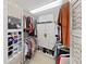 Organized walk-in closet with shelving, hanging rods, and ample storage space at 4544 Harbor Hills Dr, Largo, FL 33770
