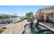 Waterfront patio featuring lounge chairs, outdoor seating, and a relaxing spa overlooking the water at 4544 Harbor Hills Dr, Largo, FL 33770