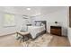 Serene bedroom with neutral tones, stylish decor, and ample natural light at 4613 Irene Loop, New Port Richey, FL 34652
