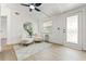 Bright living area with modern furnishings, stylish rug, and a glass door at 4613 Irene Loop, New Port Richey, FL 34652