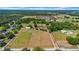 Panoramic aerial perspective of property showcasing residences, fields, and country surroundings at 4615 Keene Rd, Plant City, FL 33565