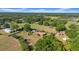 Aerial view of a single-story home with surrounding trees and fields at 4615 Keene Rd, Plant City, FL 33565