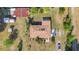 Aerial view of home showcasing the roof, back patio, multiple buildings, and surrounding acreage at 4615 Keene Rd, Plant City, FL 33565