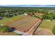 Aerial of expansive property outlined in red, showcasing potential building space, road frontage and existing structures at 4615 Keene Rd, Plant City, FL 33565