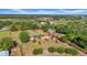 Scenic aerial view showing a sprawling property with multiple structures and natural landscaping at 4615 Keene Rd, Plant City, FL 33565