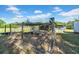 Fenced animal pen, perfect for raising poultry, with other outbuildings in background at 4615 Keene Rd, Plant City, FL 33565