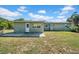 Home showcasing a private backyard with a patio and ample outdoor space for relaxation and entertainment at 4615 Keene Rd, Plant City, FL 33565