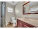 Clean, neutral bathroom features new vanity, toilet, and tiled shower with a window at 4615 Keene Rd, Plant City, FL 33565