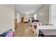 Bright bedroom with tile flooring, ceiling fan, and twin beds at 4615 Keene Rd, Plant City, FL 33565
