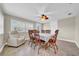 Bright dining room features a ceiling fan, windows and neutral walls at 4615 Keene Rd, Plant City, FL 33565