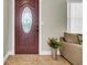 Inviting foyer with a decorative front door and neutral decor, creating a warm and welcoming atmosphere at 4615 Keene Rd, Plant City, FL 33565