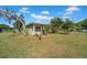 Charming home featuring verdant lawn with mature landscaping, offering a tranquil and inviting curb appeal at 4615 Keene Rd, Plant City, FL 33565