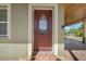 Elegant front door with decorative glass and a tiled entryway, leading to a welcoming home at 4615 Keene Rd, Plant City, FL 33565