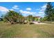 Single-story home with a covered carport and well-maintained lawn, offering ample outdoor space at 4615 Keene Rd, Plant City, FL 33565