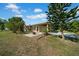 This charming house is located on a large grassy lot with mature trees at 4615 Keene Rd, Plant City, FL 33565