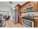 Updated kitchen with stainless steel appliances and rich wood cabinets at 4615 Keene Rd, Plant City, FL 33565