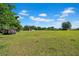 Expansive land plot featuring lush grass under a vast sky ready for building at 4615 Keene Rd, Plant City, FL 33565