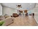 Open-concept living space with tile floors, seamlessly connecting to the kitchen and dining area at 4615 Keene Rd, Plant City, FL 33565