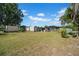 Property featuring multiple outbuildings, perfect for storage, workshops, or hobby spaces on a large lot at 4615 Keene Rd, Plant City, FL 33565