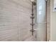 Updated shower with wood-look tile and multiple shower heads at 4615 Keene Rd, Plant City, FL 33565
