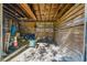Property featuring ample storage inside of a three-sided barn with a covered roof at 4615 Keene Rd, Plant City, FL 33565