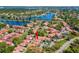 Aerial view of the neighborhood featuring lush landscaping and proximity to the lake at 4859 Napoli Ne Ct # 4859, St Petersburg, FL 33703