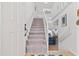 Bright entryway with staircase leading to upper level and open living space at 4859 Napoli Ne Ct # 4859, St Petersburg, FL 33703